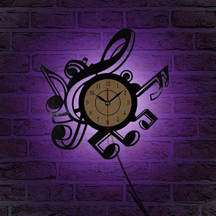 Reloj de vinilo con notas musicales