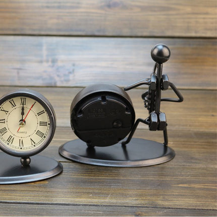 Reloj de mesa de hierro músico