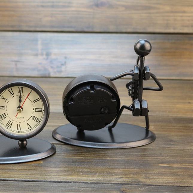 Reloj de mesa de hierro músico