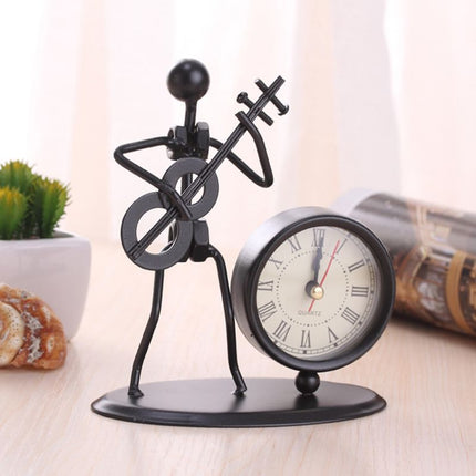 Reloj de mesa de hierro músico