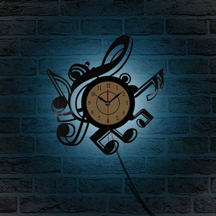 Reloj de vinilo con notas musicales