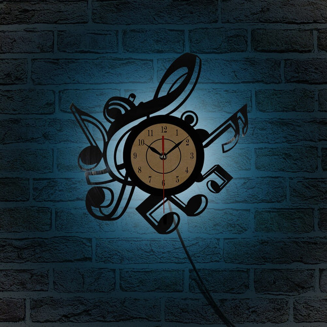 Reloj de vinilo con notas musicales