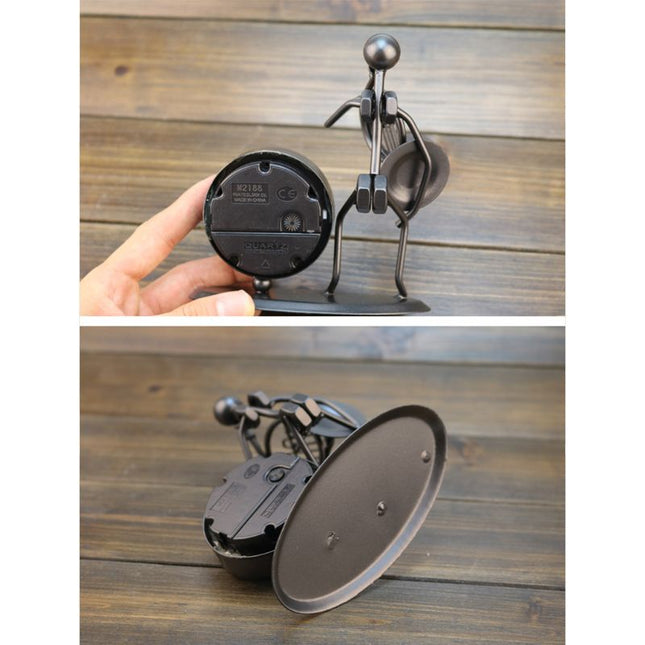 Reloj de mesa de hierro músico