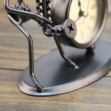 Reloj de mesa de hierro músico