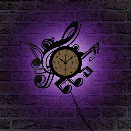 Reloj de vinilo con notas musicales