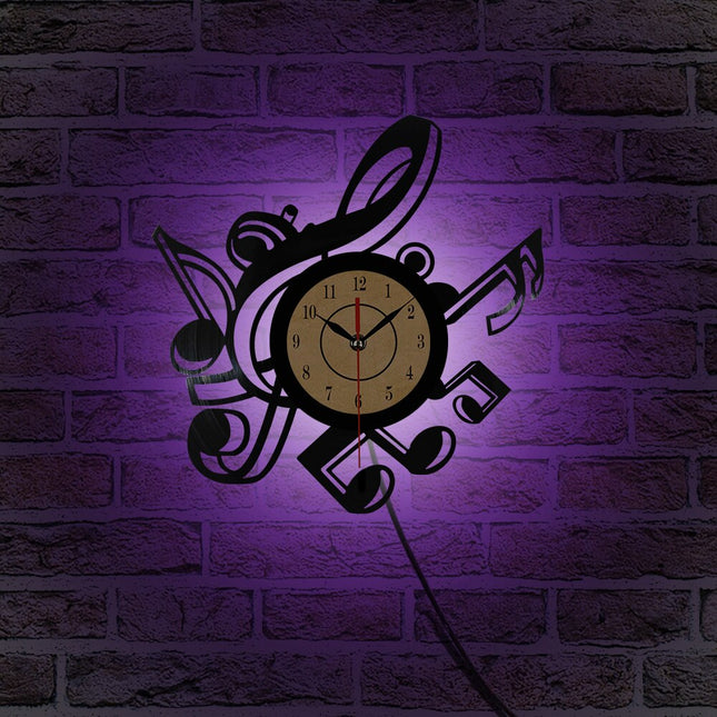 Reloj de vinilo con notas musicales