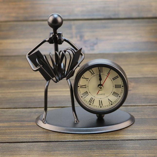 Reloj de mesa de hierro músico