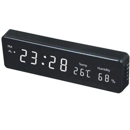 Reloj digital con termómetro e higrómetro