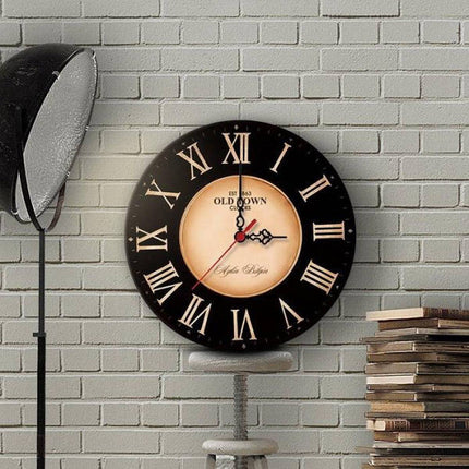 Reloj de pared vintage negro y dorado