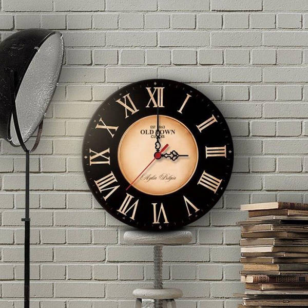 Reloj de pared vintage negro y dorado